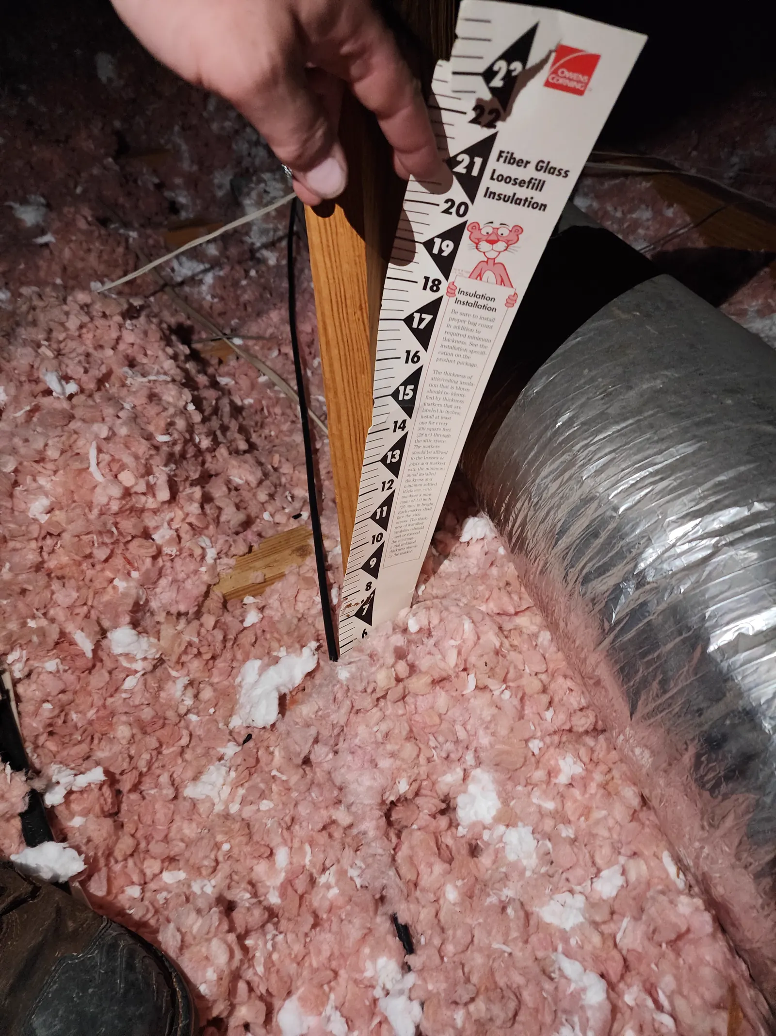 Blown-in attic insulation measured for depth